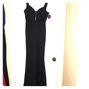 Long, black formal dress with mesh top & high slit